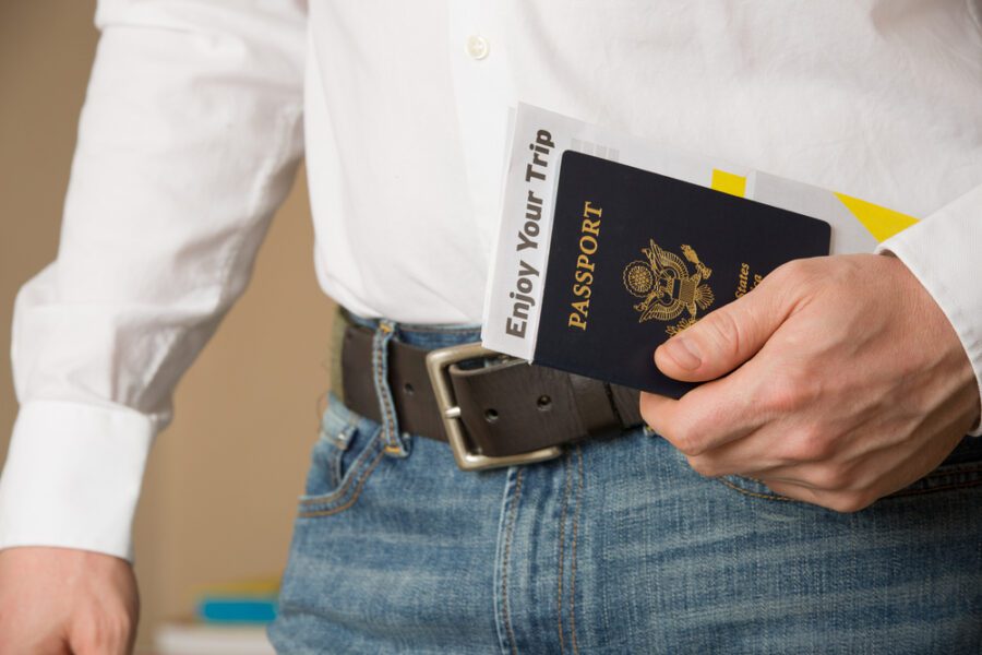 Image,Of,A,Persons,Hand,Holding US Passport,And,Ready
